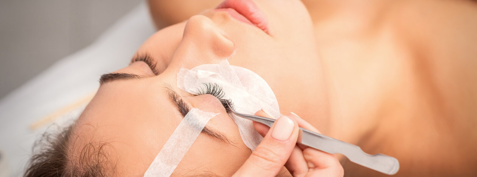 young-caucasian-woman-having-eyelash-extension-procedure-beauty-salon-beautician-glues-eyelashes-with-tweezers.jpg young-caucasian-woman-having-eyelash-extension-procedure-beauty-salon-beautician-glues-eyelashes-with-tweezers.jpg